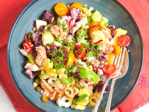 A bowl of fish, beets, avocado, tomatoes: a delicious looking, colourful dish that is an Eat Burn Sleep recipe.