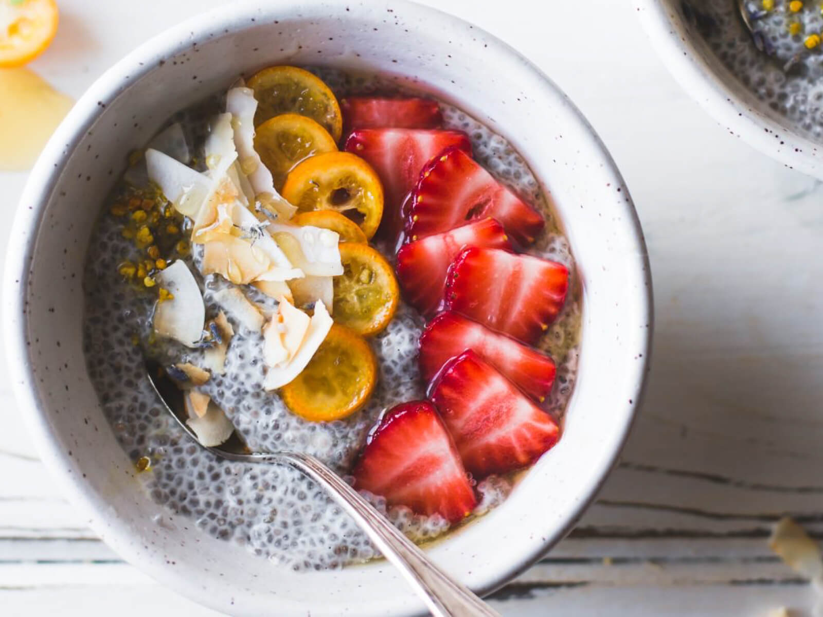 A bowl of dairy free chia pudding with fruit - a recipe on the EBS Lifestyle Program