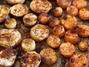 Vegetables roasted on a tray with spices - a recipe to reduce chronic inflammation.