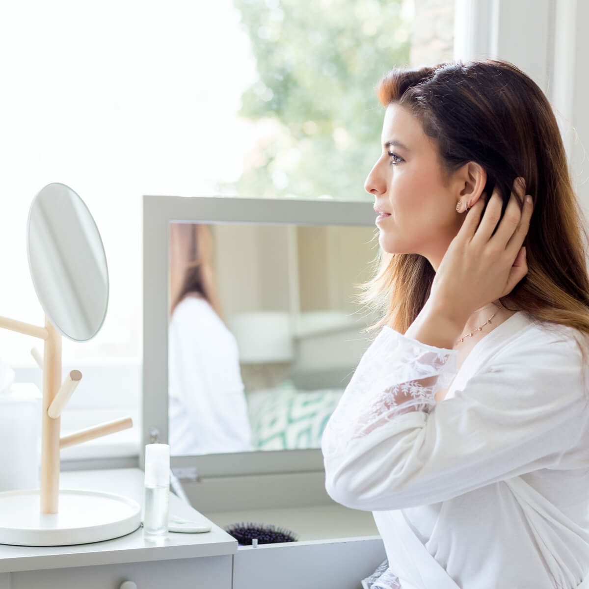 skincare - Yalda looking in the mirror