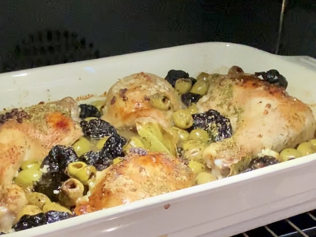A dish of chicken and other gut and mind-boosting ingredients in a roasting dish.