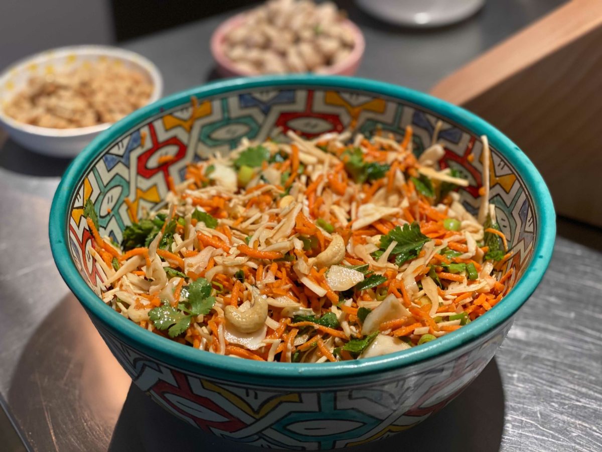 A bowl of chopped salad with herbs and a dressing in a Vietnamese style; an anti-inflammatory recipe.