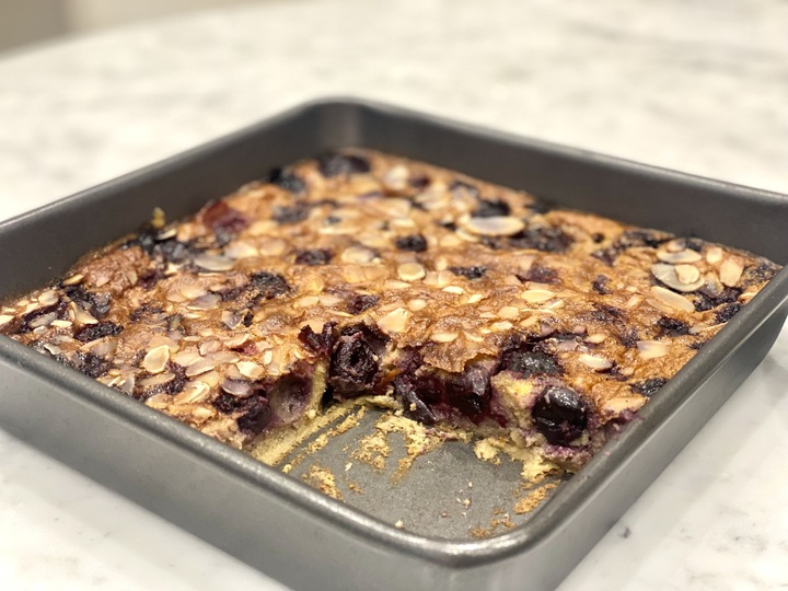 A tray of cherry and almond cake that is a gut healthy recipe.
