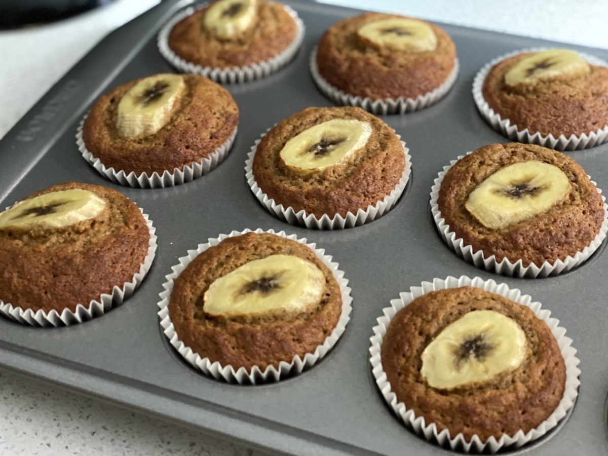 Anti-inflammatory desserts range: a tray of banana muffins with a slice of banana on top.