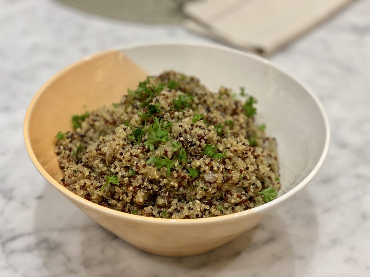 A bowl of cooked quinoa, which is part of a gut healthy recipe plan.