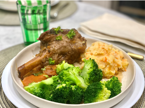 A plate of shanks of lamb, broccoli and special mash.