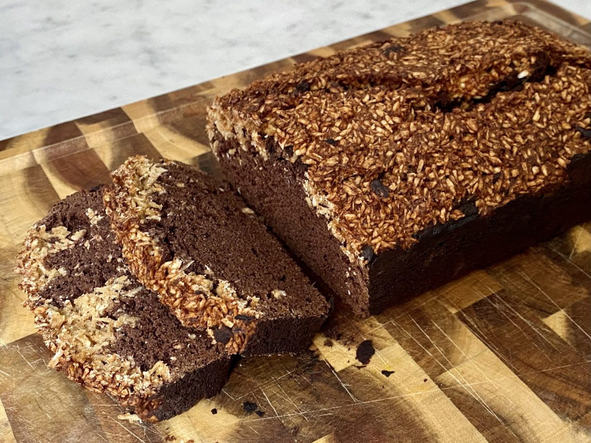Cacao and Coconut cake on a wooden chopping board