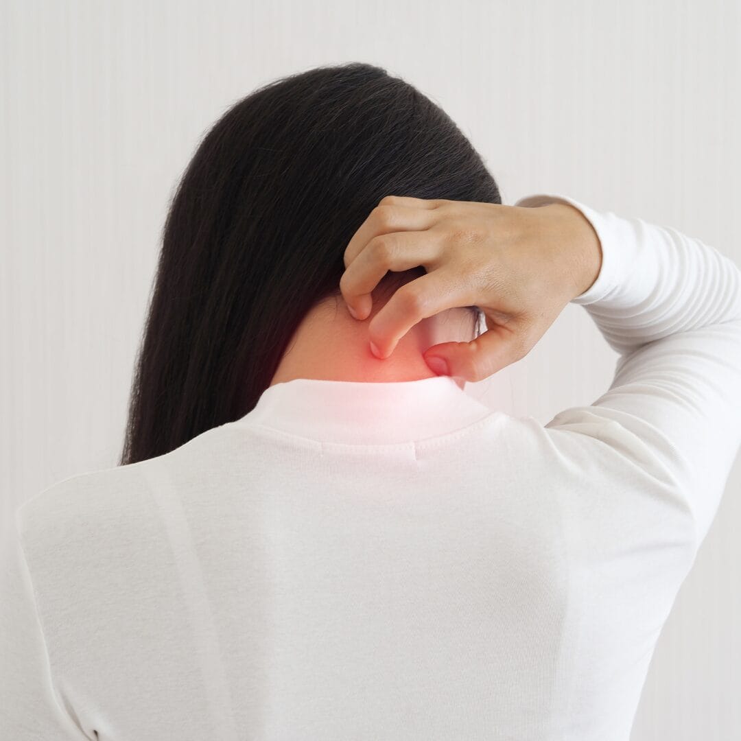 Hand touching neck as if in pain on isolated white background as if suffers from Fibromyalgia