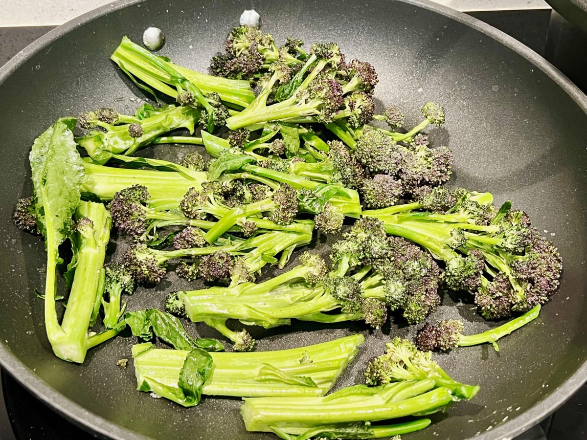 frying pan with purple sprouting broccoli