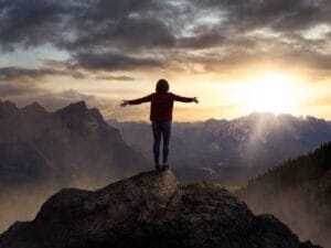 woman at top of mountain