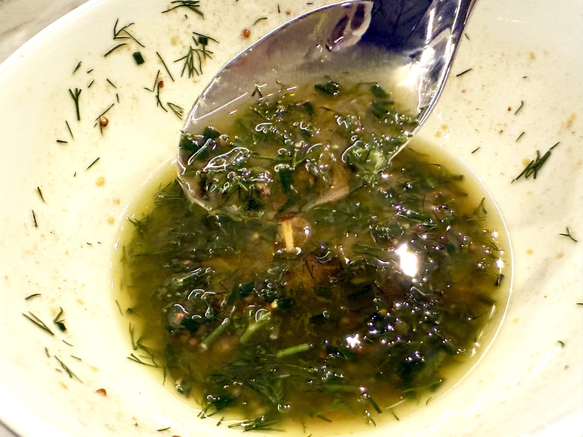 Close up of bowl with a chives and dill dressing