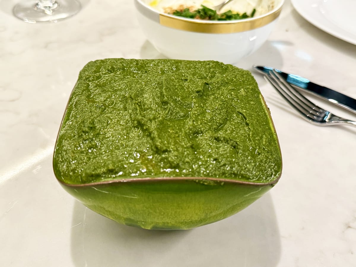 Green bowl of spinach curry