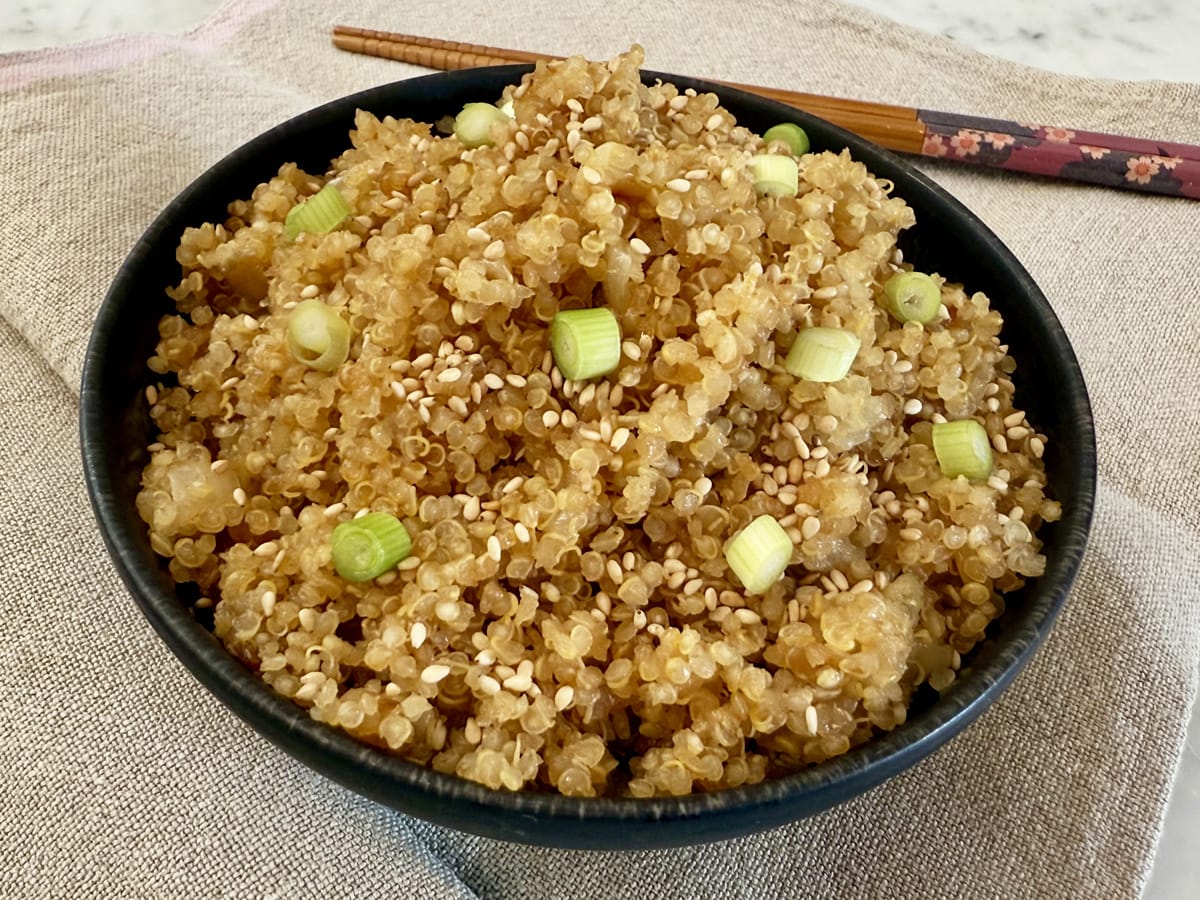 bowl of asian quinoa and chopsticks on the side