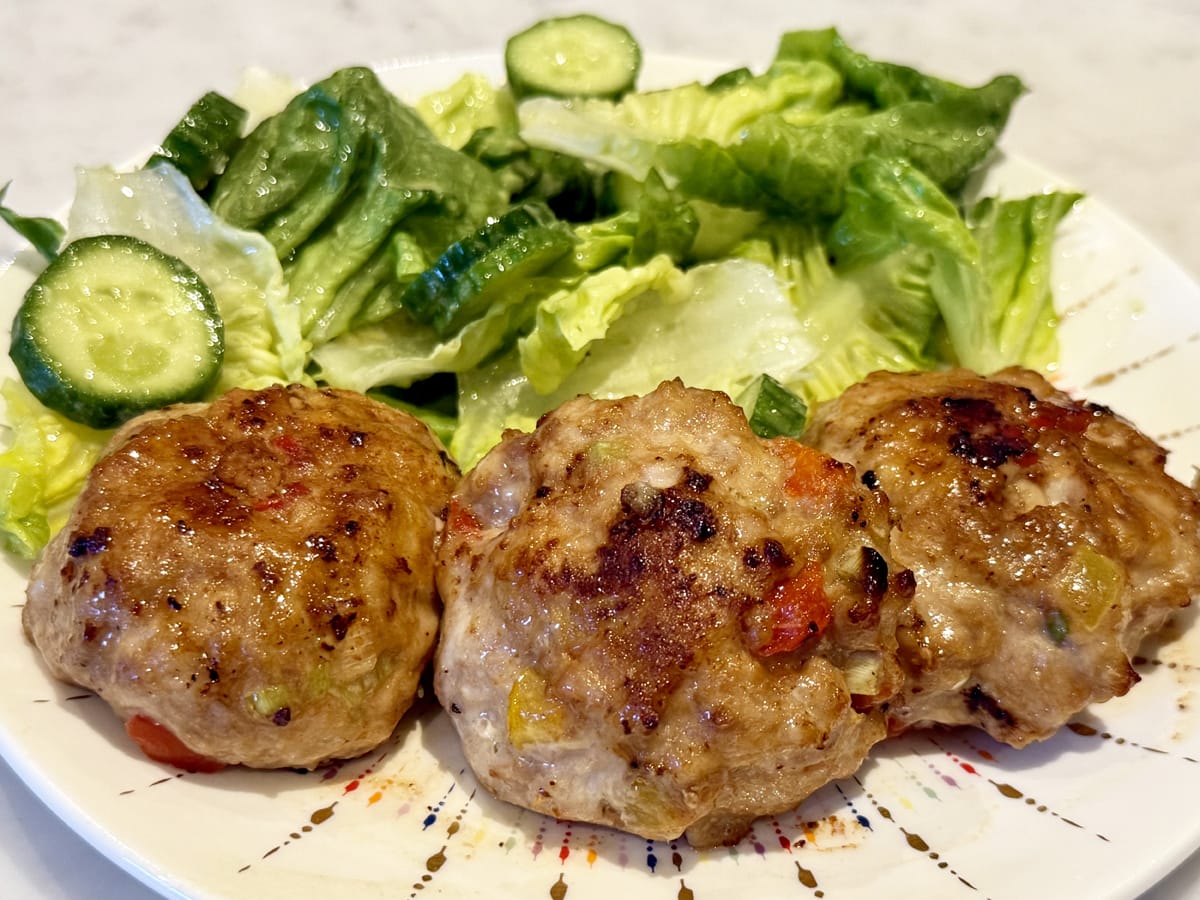 Asian chicken patties with a side salad