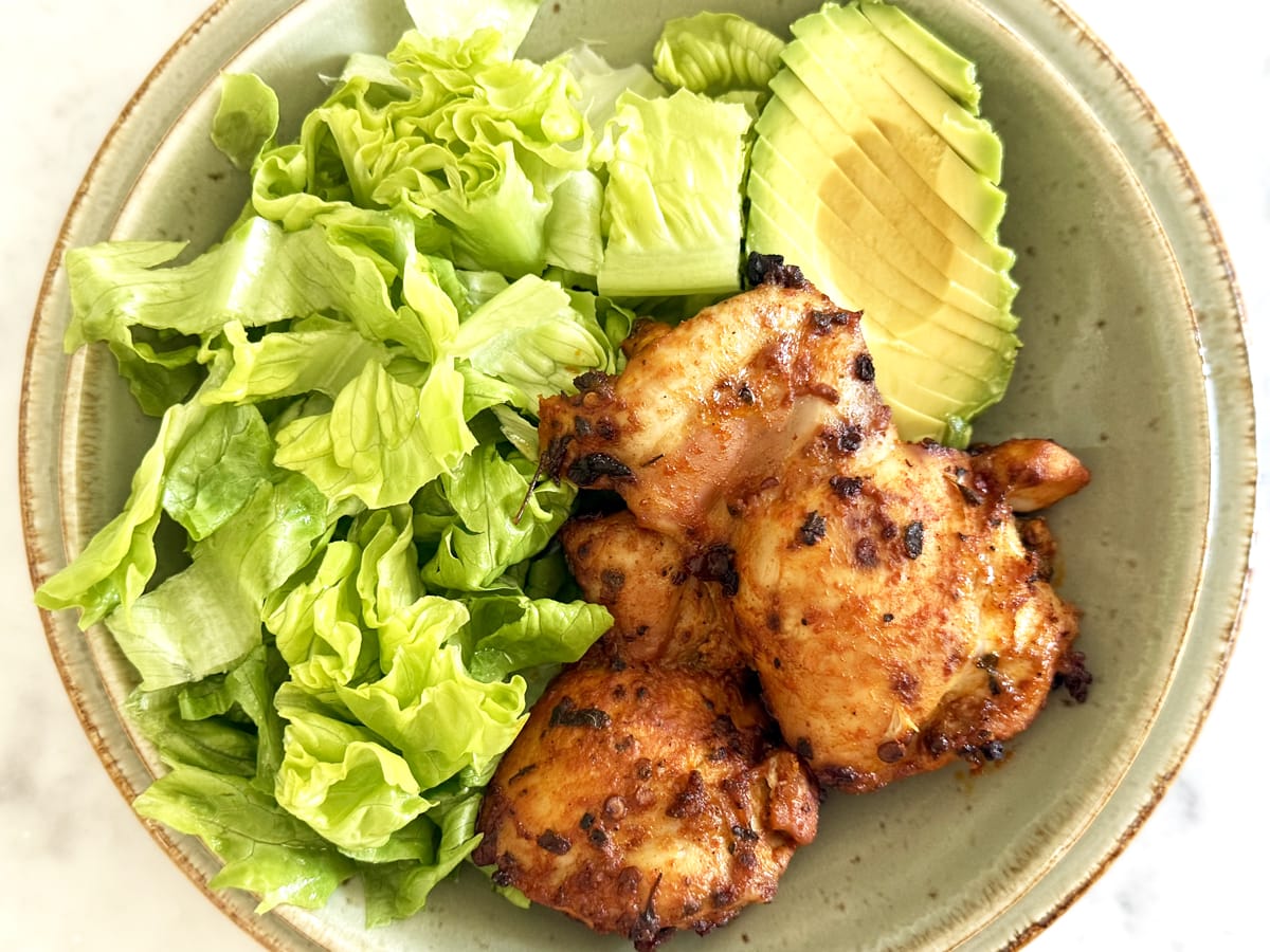 Mexican Marinated Chicken with salad and an avocado.